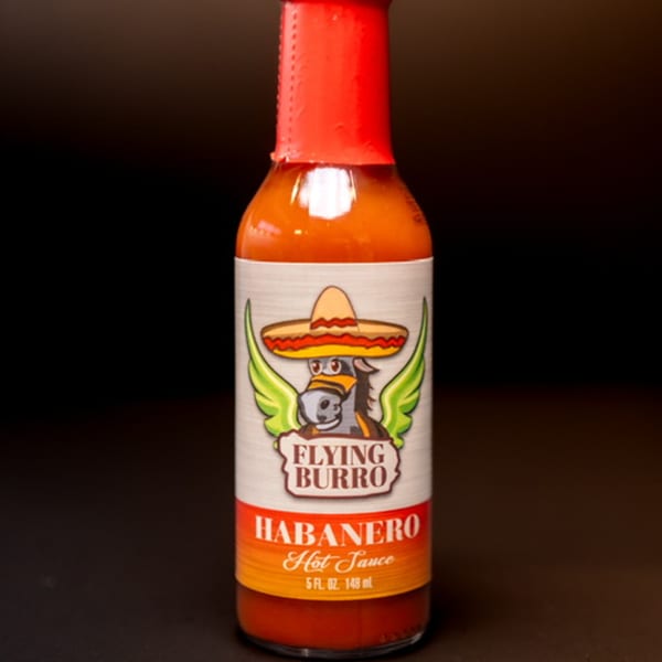 Flying Burro Habanero Hot Sauce bottle with a winged donkey wearing a sombrero on the label.